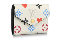 LOUIS VUITTON Zoe Wallet Game On White