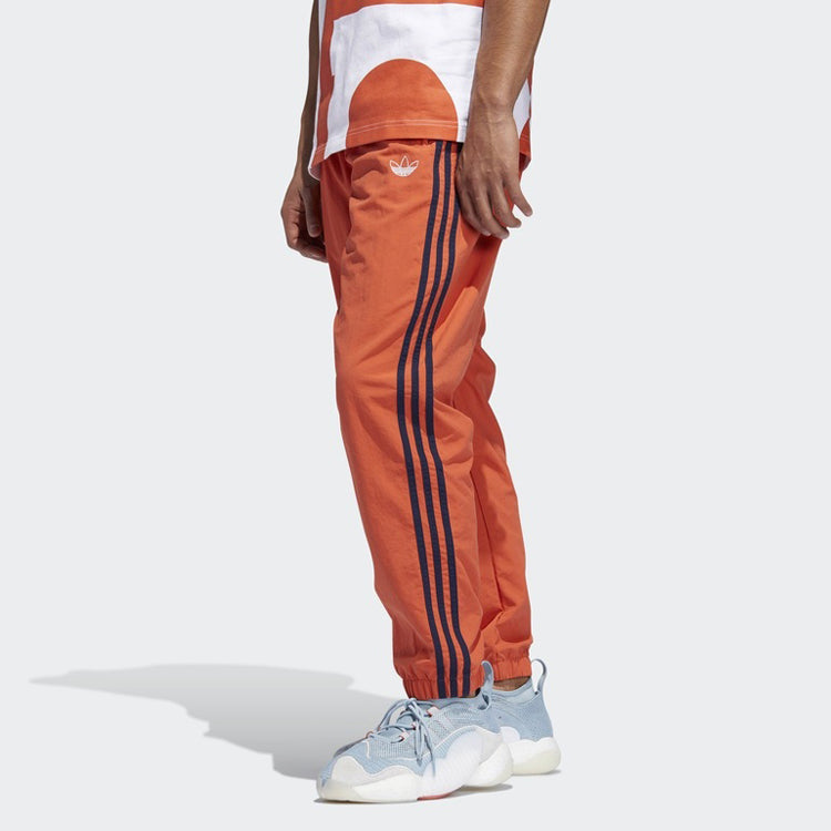 adidas originals Woven Three Stripe Warm up Pants DV3141